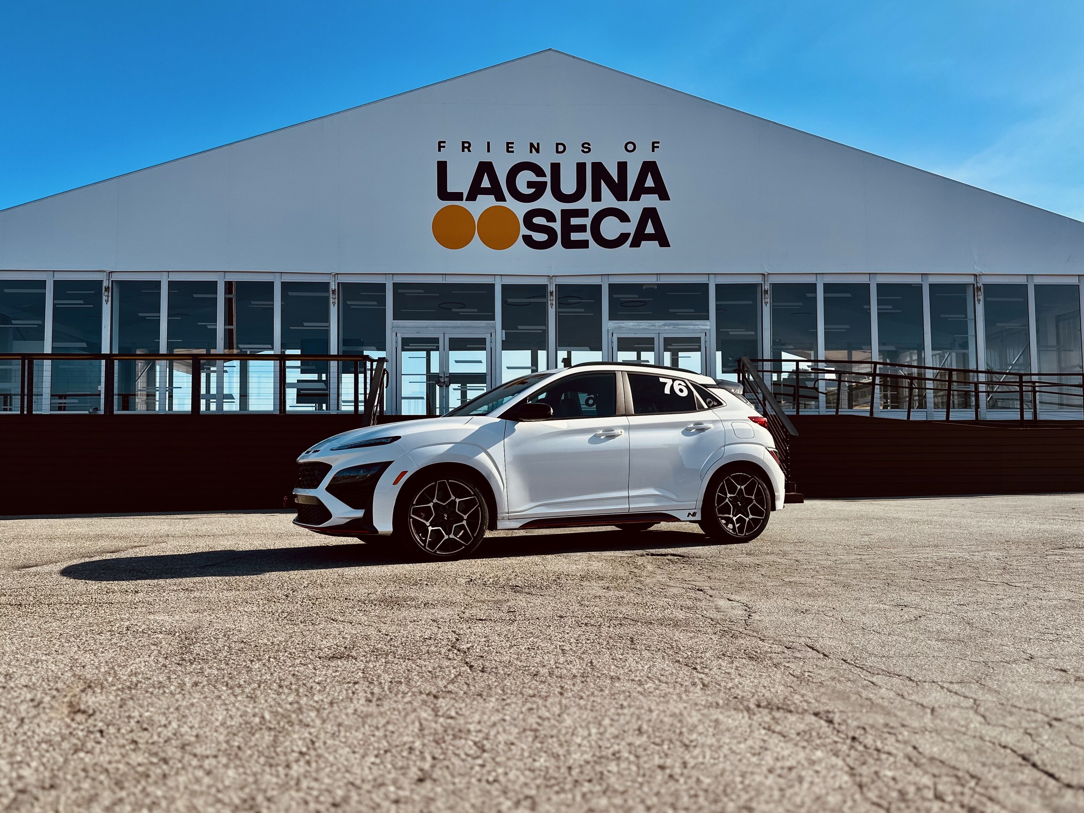 Kona N parked in front of a Laguna Seca building. 
