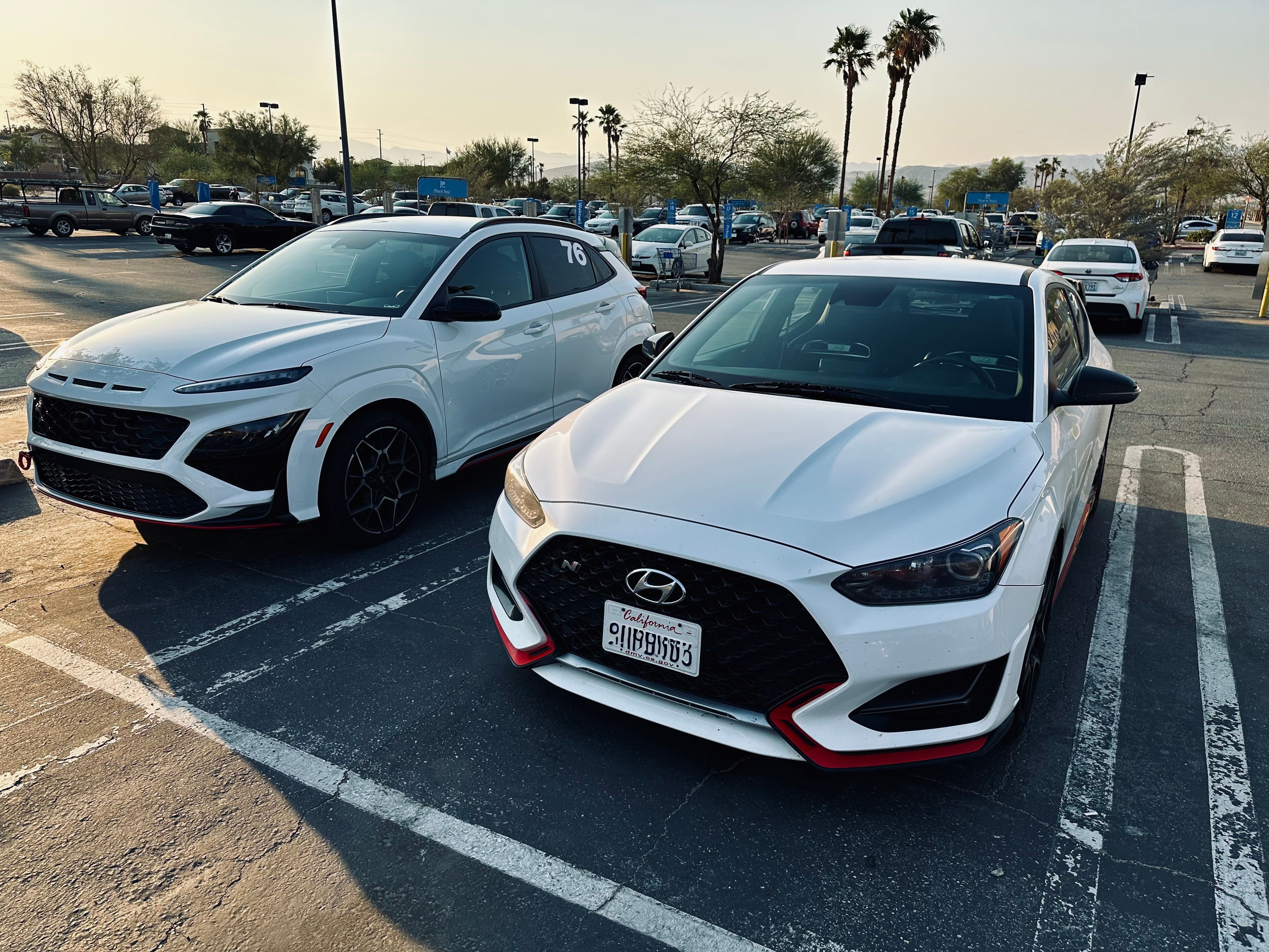 Kona N parked next to a Veloster N. 