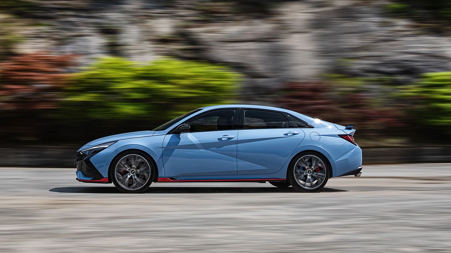 Elantra N vehicle driving on the road with its left side facing away