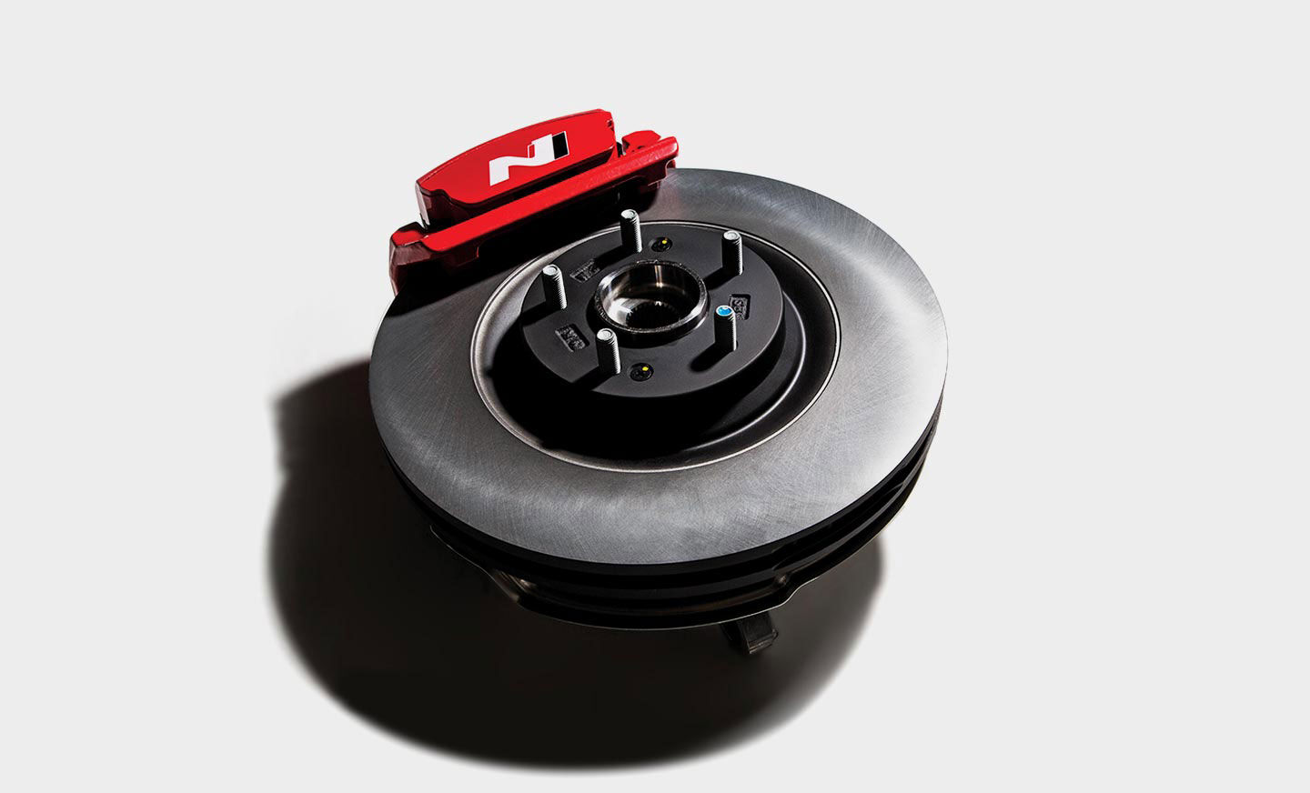 Brake caliper mounted on the car's wheel.