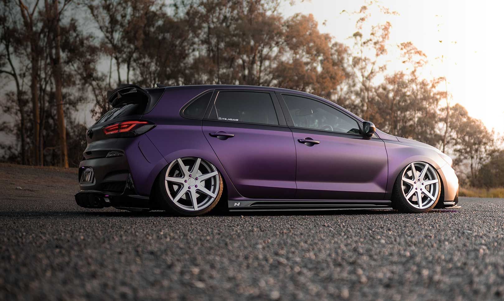 The side of the vehicle is visible, with sunlight shining on the right side.