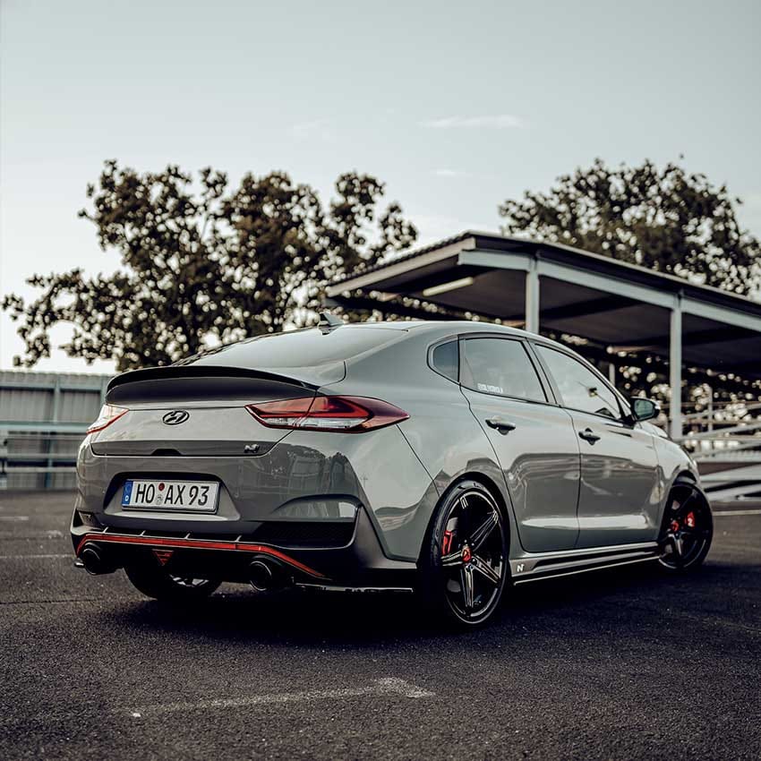 A parked vehicle viewed from the right side. The right side and rear of the vehicle are visible.