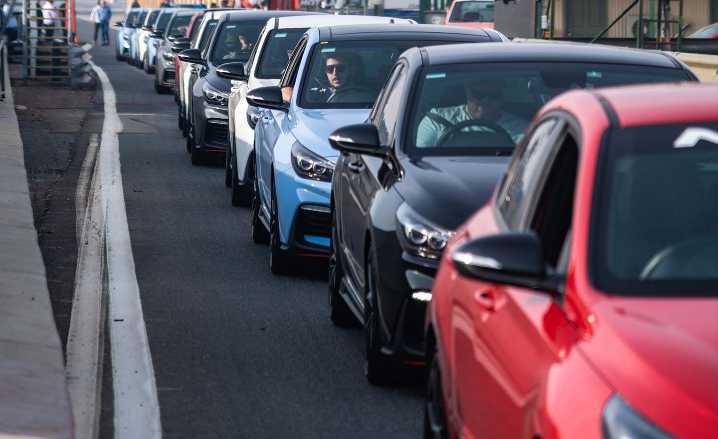 Drivers operating their vehicles before the track day.