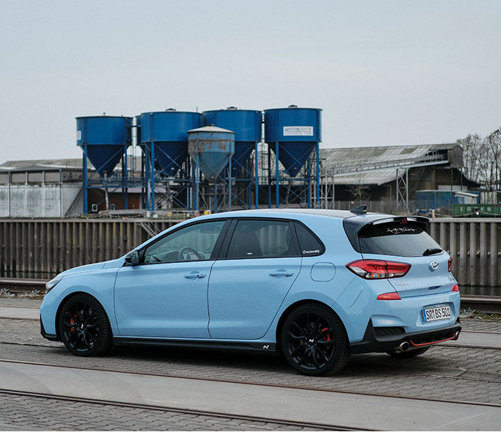 A car parked next to a factory