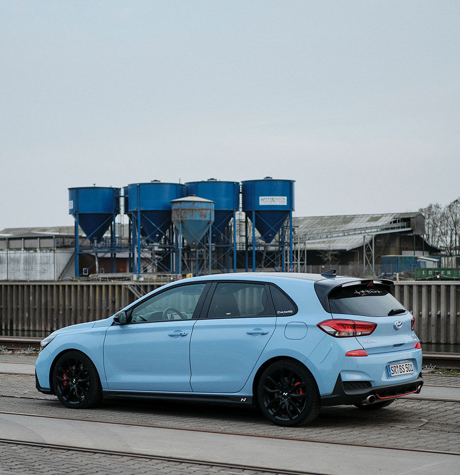 A car parked next to a factory